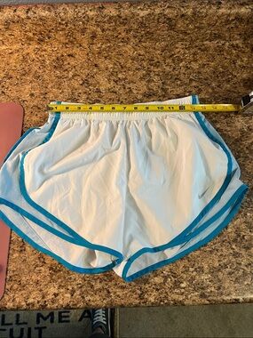 Nike Women's White Athletic Shorts with Teal Trim